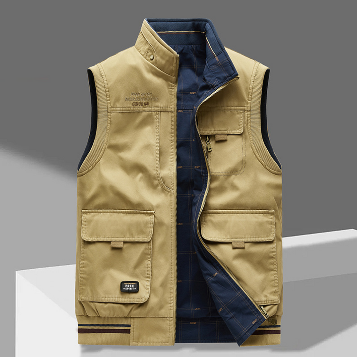 Men's rugged multi-pocket utility vest, durable cotton for outdoor activities and casual layering. Ample storage.
