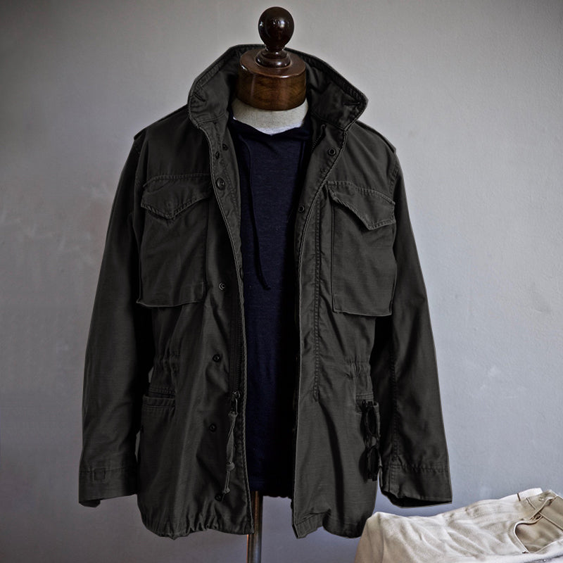 Durable men's hooded outdoor field jacket for rugged style. A versatile utility jacket for various weather.