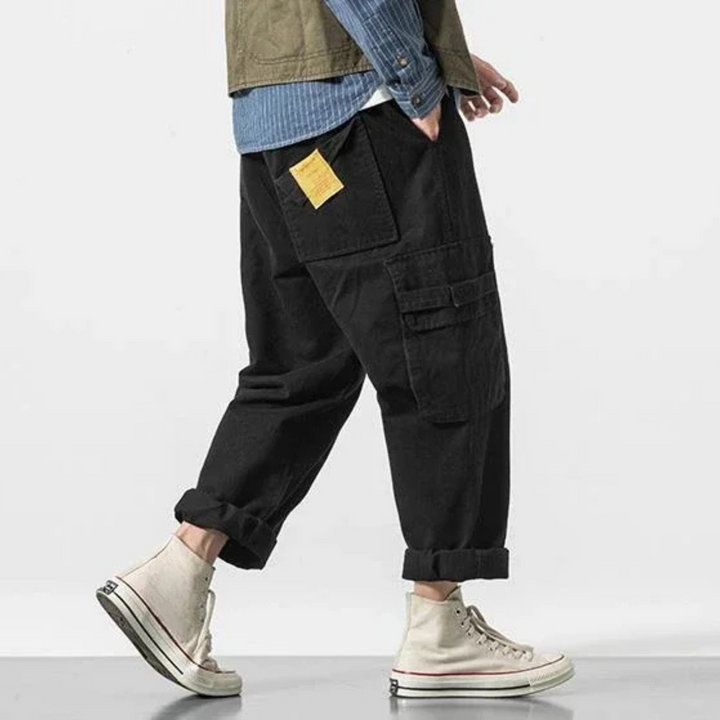 Men's cotton cargo pants, rugged utility style, relaxed fit for streetwear and casual everyday fashion.