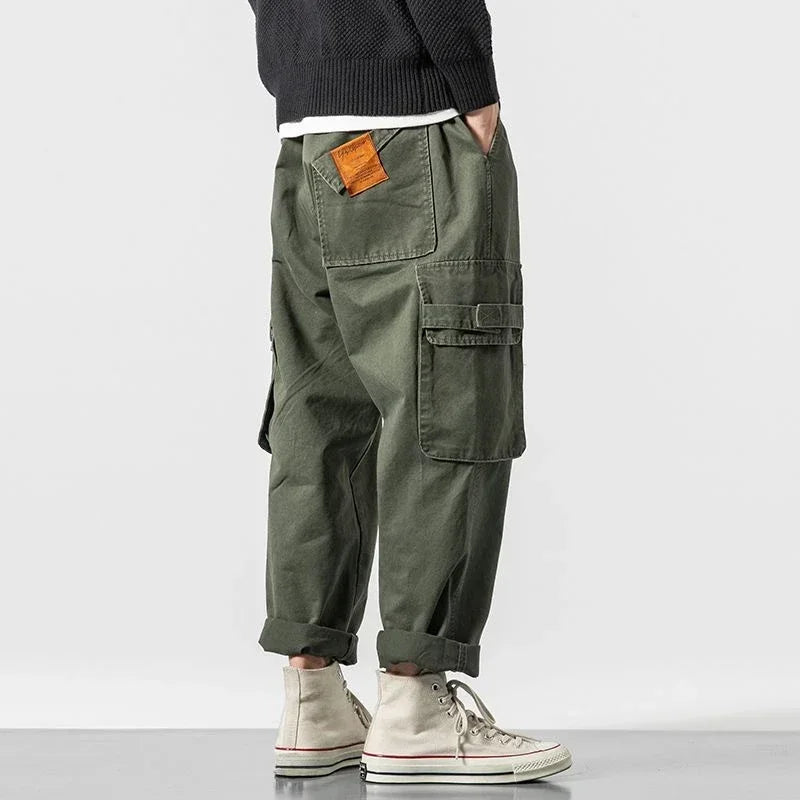 Durable cotton men's cargo pants, rugged utility design, perfect for casual & streetwear fashion.