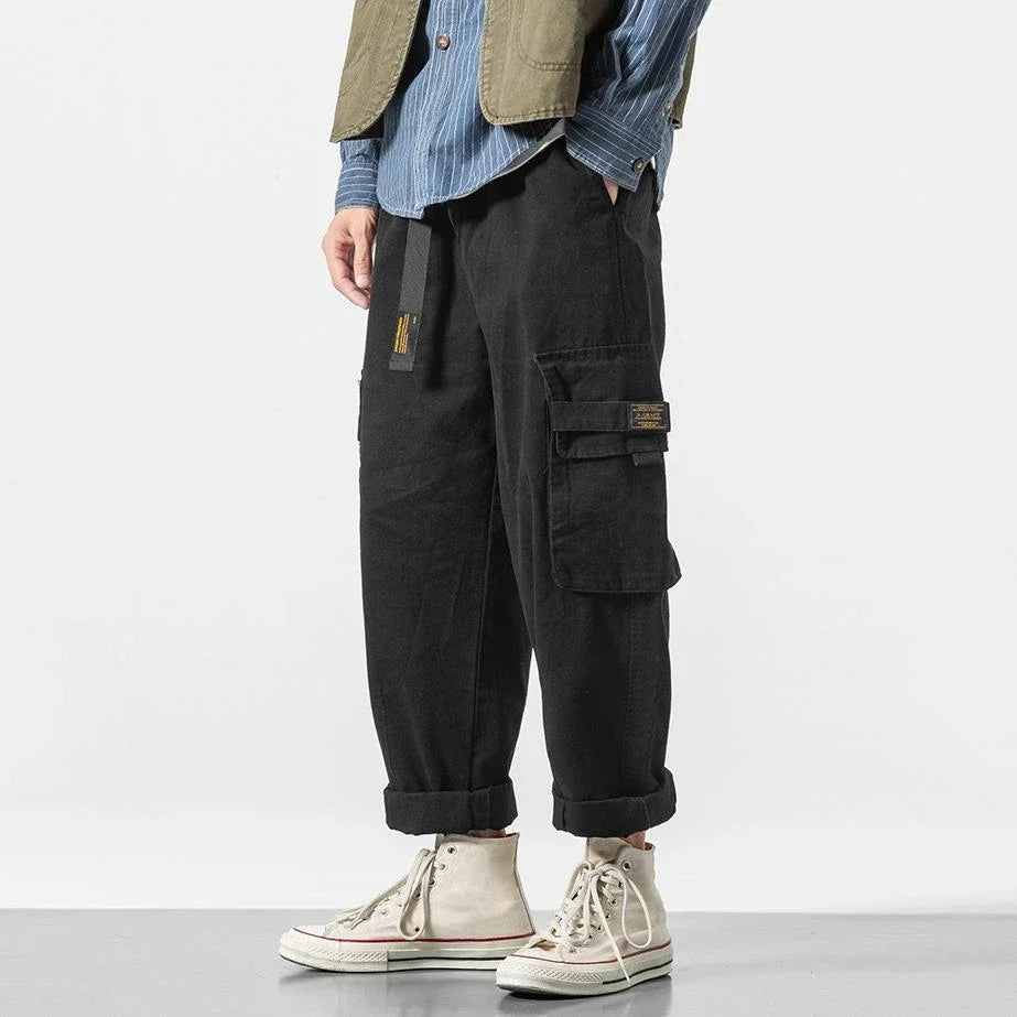 Stylish men's cargo pants, rugged utility aesthetic, relaxed fit cotton for a casual streetwear look.