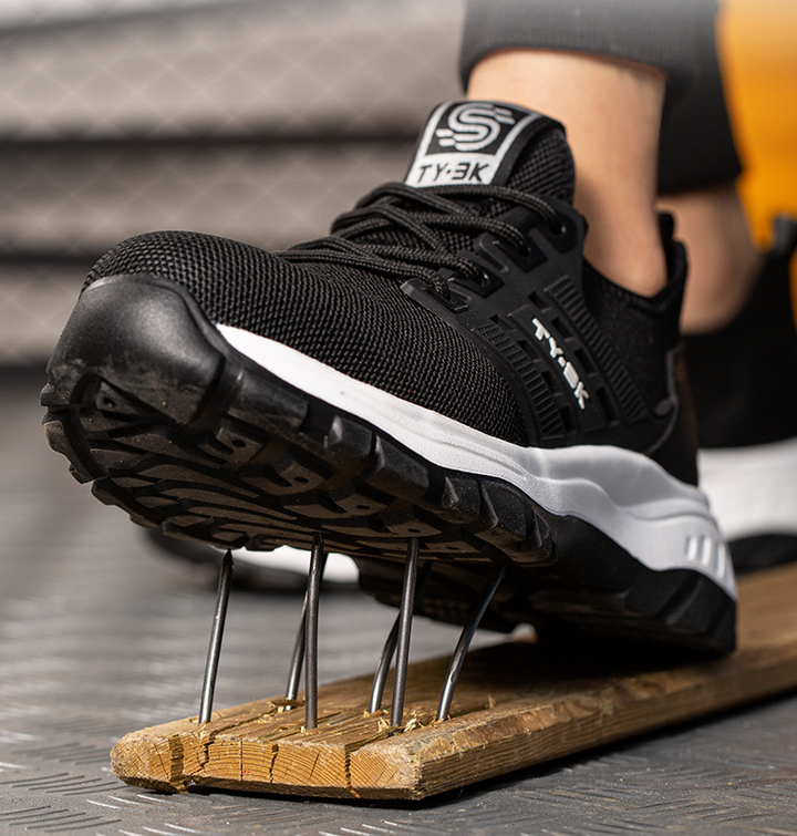 Durable men's safety footwear, SafeStep industrial boots providing foot protection & orthopedic support for tough work.