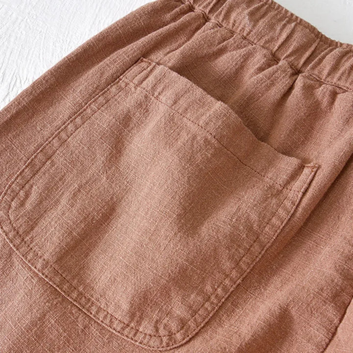 Close-up of men's drawstring shorts texture, highlighting comfortable summer fabric.