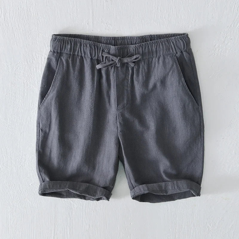 Man in men's Santorini shorts, enjoying vacation. Perfect relaxed fit beachwear.