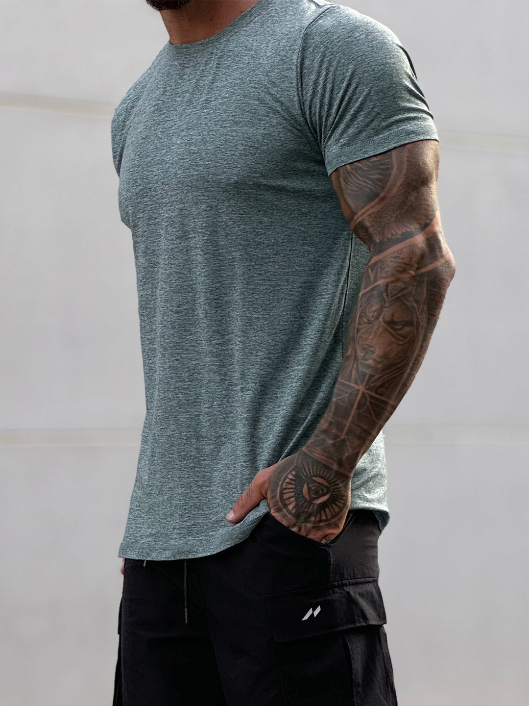 Blue Men's Sevilla Performance Tee. Modern fit athletic shirt for versatile workout gear.