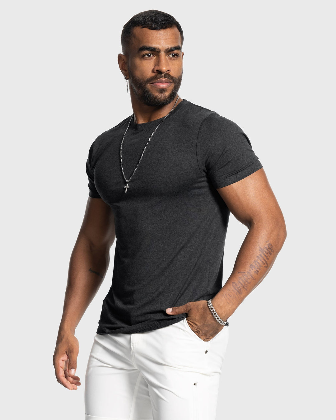 Model wearing a Men's Sevilla Performance Tee, demonstrating modern fit & everyday comfort.
