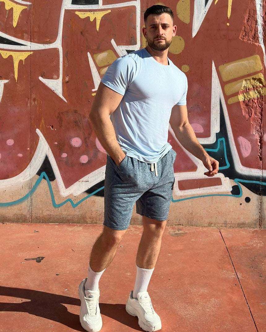 Green Men's Sevilla Performance Tee, perfect workout gear for warm-weather activities.