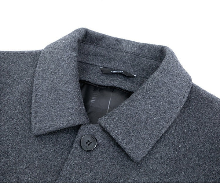 Stylish man wearing a gray tailored blazer, perfect for smart casual outfits.