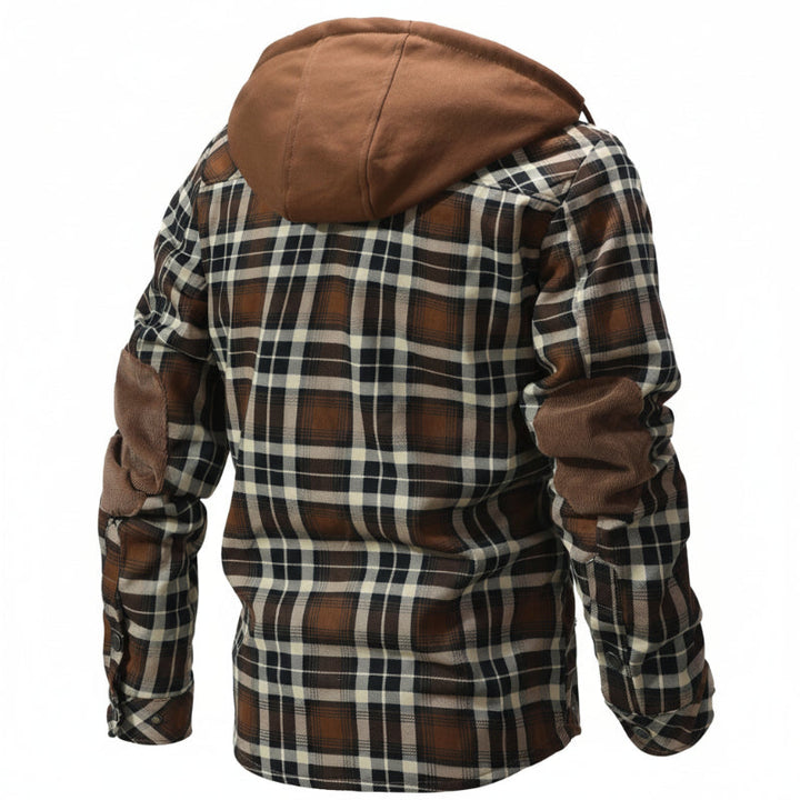 Plush sherpa interior of a men's hooded winter coat, providing supreme warmth & coziness.