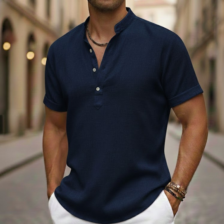 Close-up of men's short sleeve Henley polo shirt's collar, highlighting buttons and texture. Summer style.