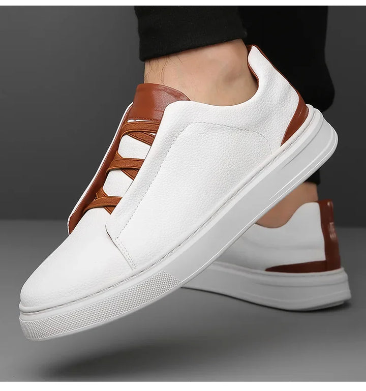 Front view of stylish men's lifestyle shoes with unique crossover lacing for a modern look.