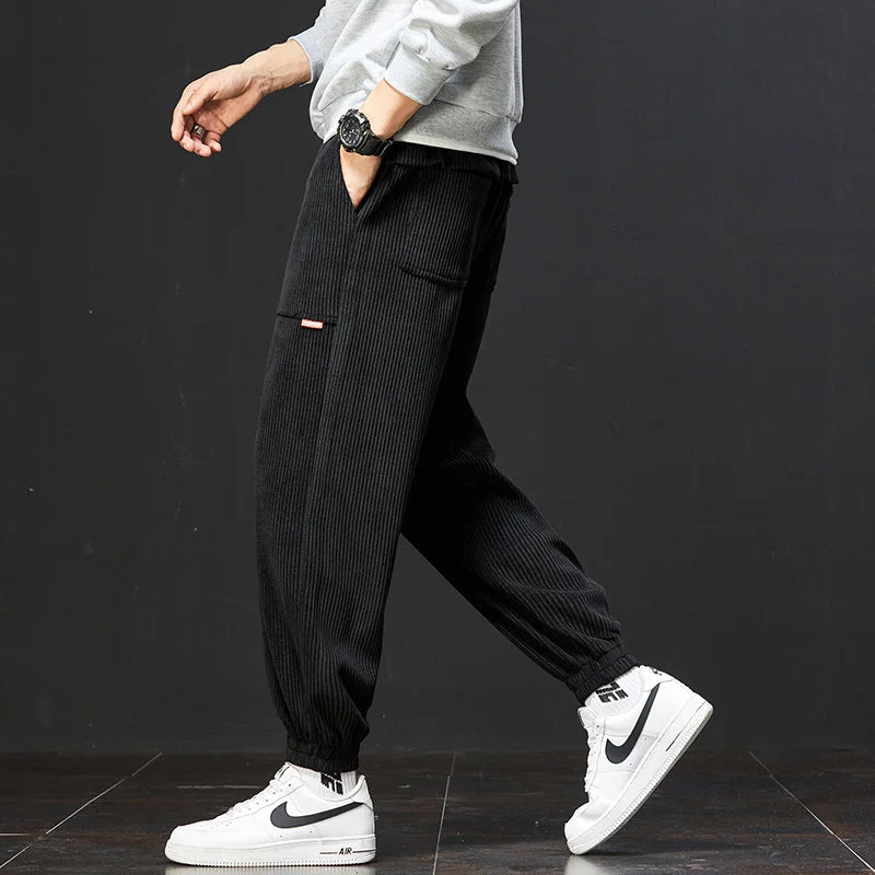 Stylish men's yellow joggers with an adjustable waist, offering a comfortable fit for everyday fashion.