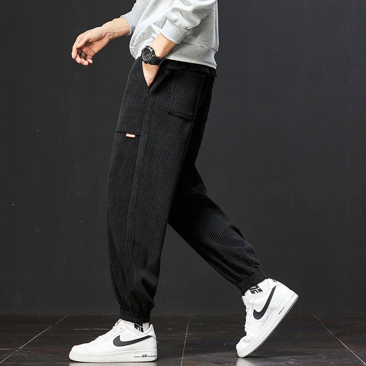 Stylish men's yellow joggers with an adjustable waist, offering a comfortable fit for everyday fashion.