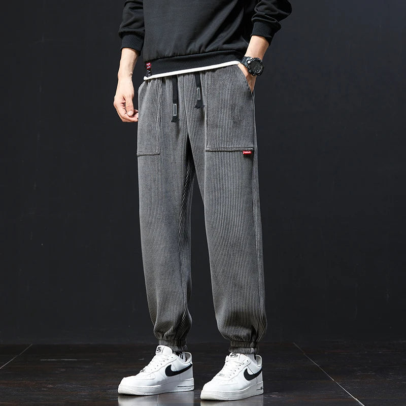 Black men's joggers, ideal for casual wear or athletic activities, showcasing versatile & relaxed style.