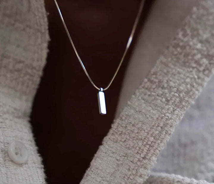 Minimalist white gold plated men's bar pendant. Modern stainless steel necklace, ideal for everyday wear.