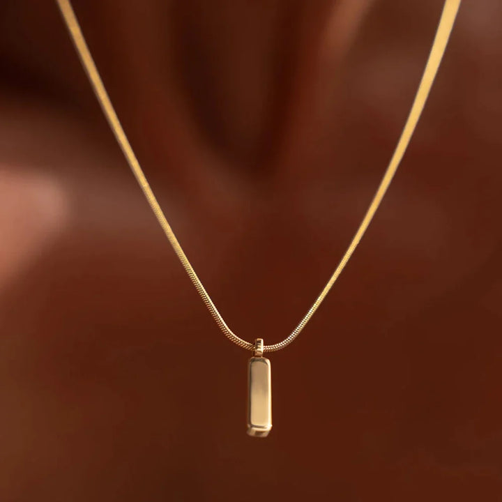 Stainless steel men's bar pendant necklace for modern, sleek style. Versatile everyday wear men's jewelry.