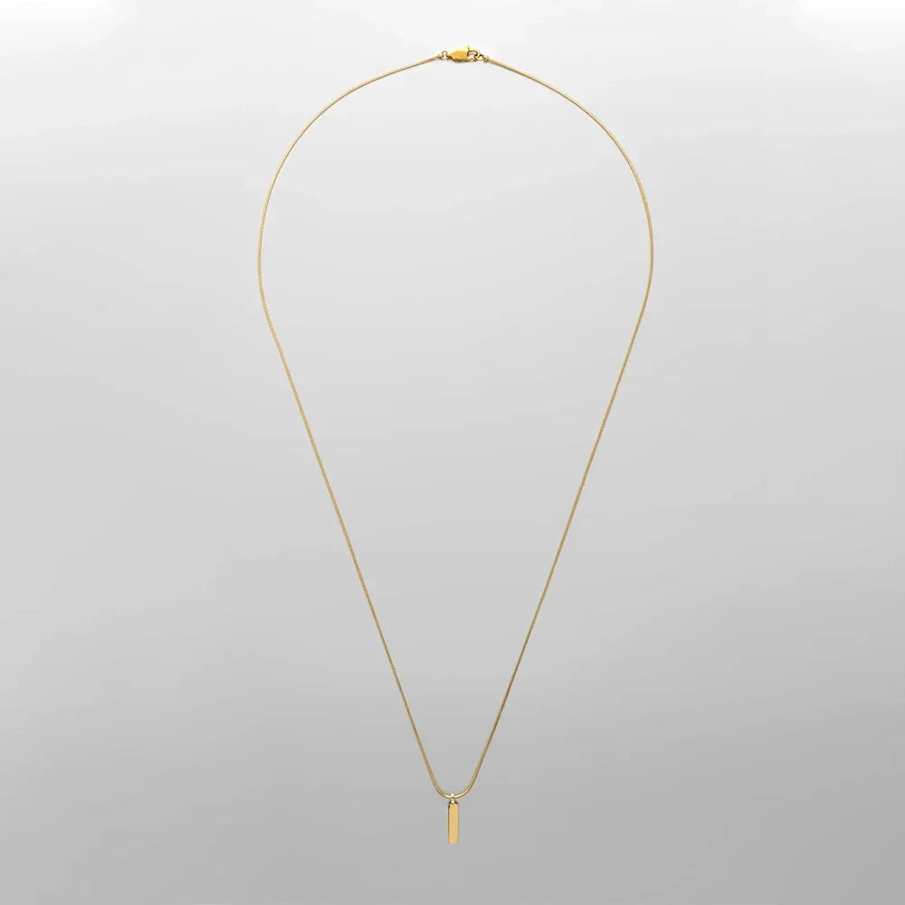 Elegant gold-plated stainless steel bar pendant necklace. Modern minimalist men's jewelry, a perfect gift for him.