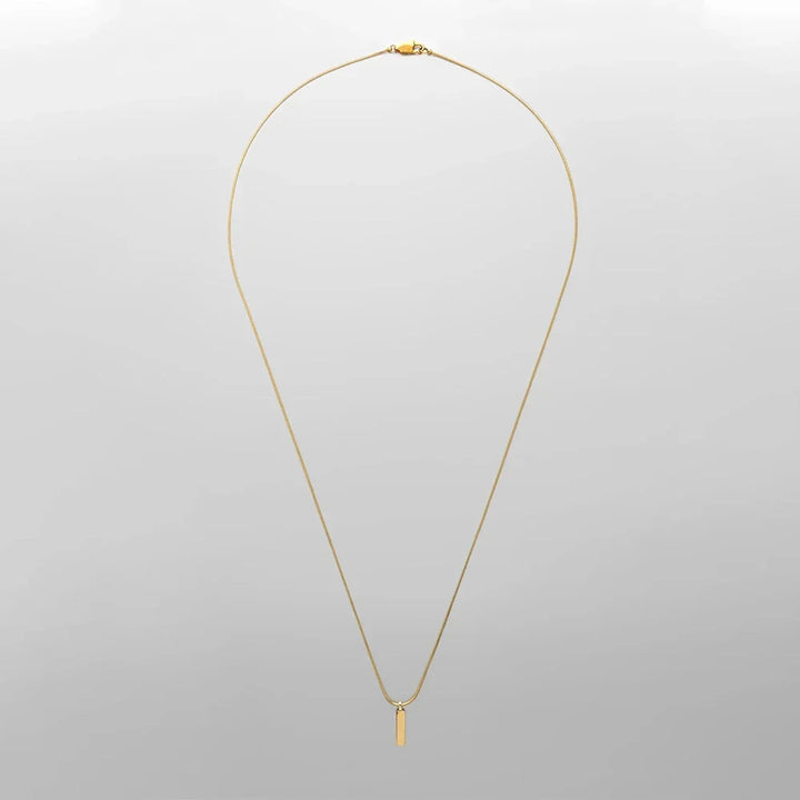 Elegant gold-plated stainless steel bar pendant necklace. Modern minimalist men's jewelry, a perfect gift for him.