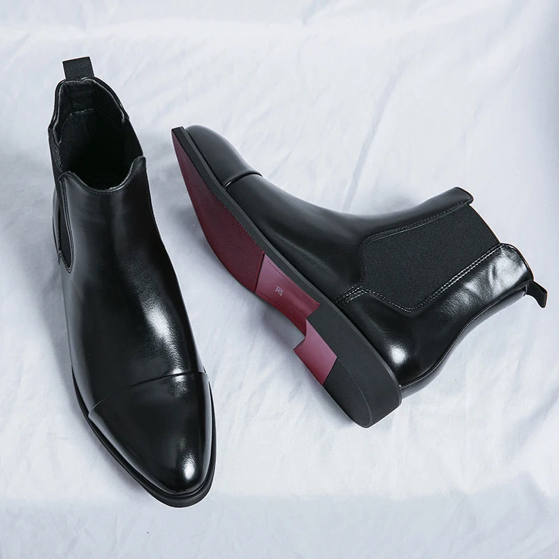 Men's sleek black slip-on comfort boots, perfect for everyday style & easy casual wear.