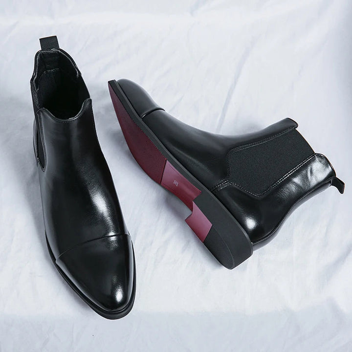 Men's sleek black slip-on comfort boots, perfect for everyday style & easy casual wear.