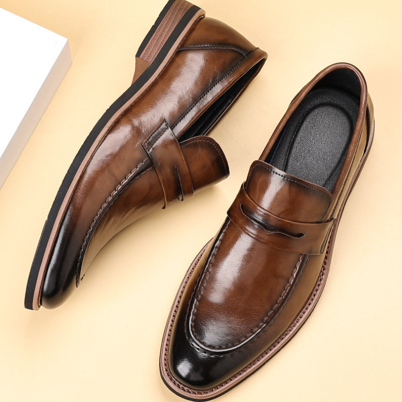 Classic black men's penny loafers, premium leather slip-on dress shoes for formal and business casual.