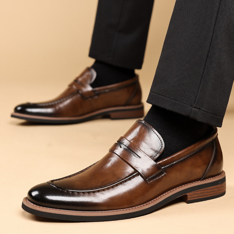 Stylish men's slip-on penny loafers, sophisticated black leather for a classic and elegant fashion statement.