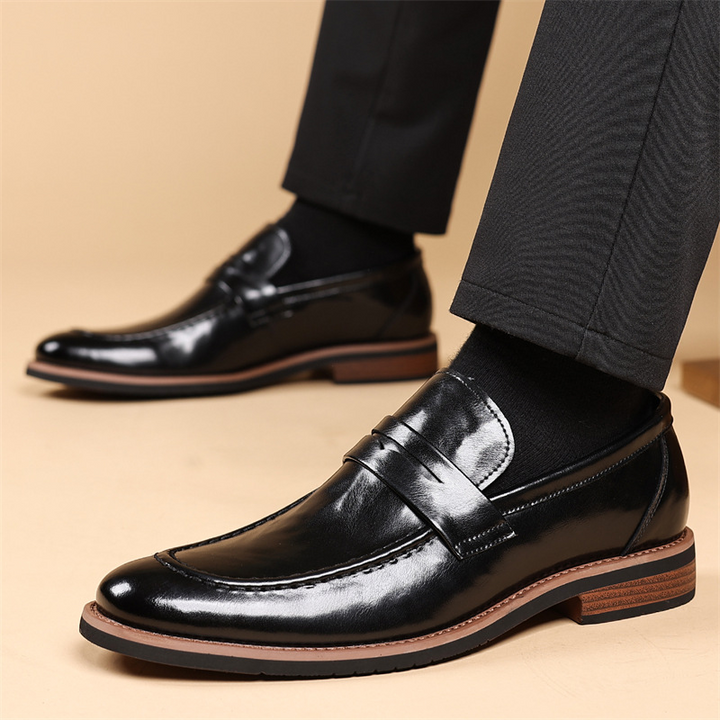 Classic men's black penny loafers, essential footwear blending sleek design with all-day comfort for men.