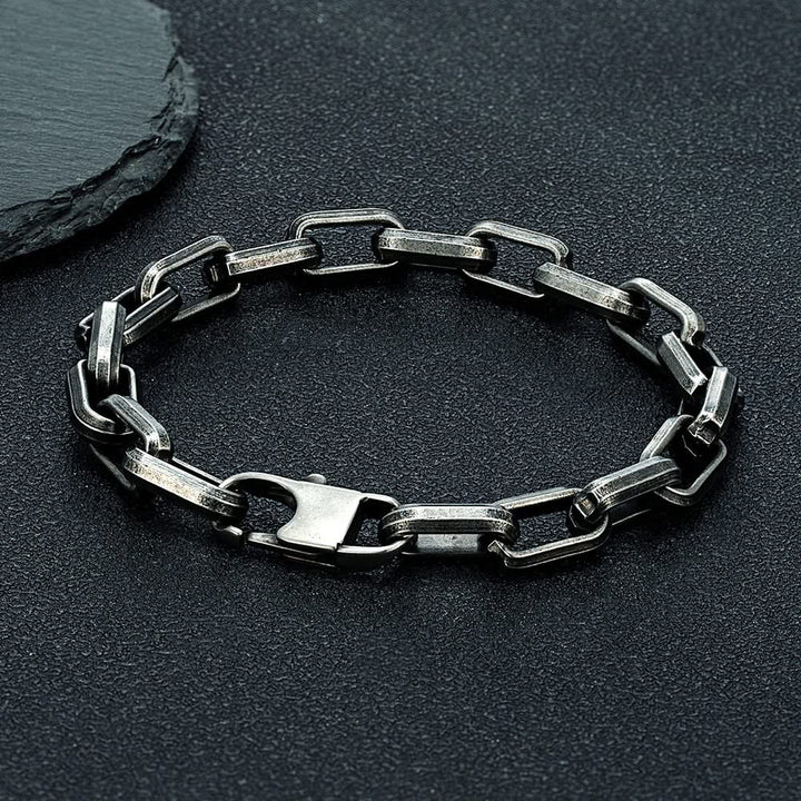 Close-up of a non-tarnishing men's chain link bracelet, showcasing its sleek, durable, and luxury design.