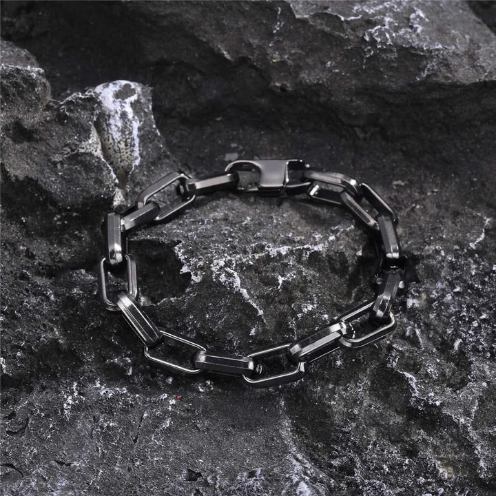 Luxury men's sleek chain link bracelet. Non-tarnishing gold-tone, a durable and stylish statement accessory.