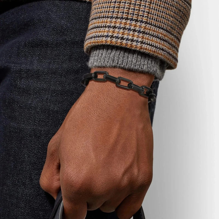 Durable men's black chain link bracelet. Sleek, non-tarnishing design; a versatile and stylish accessory.