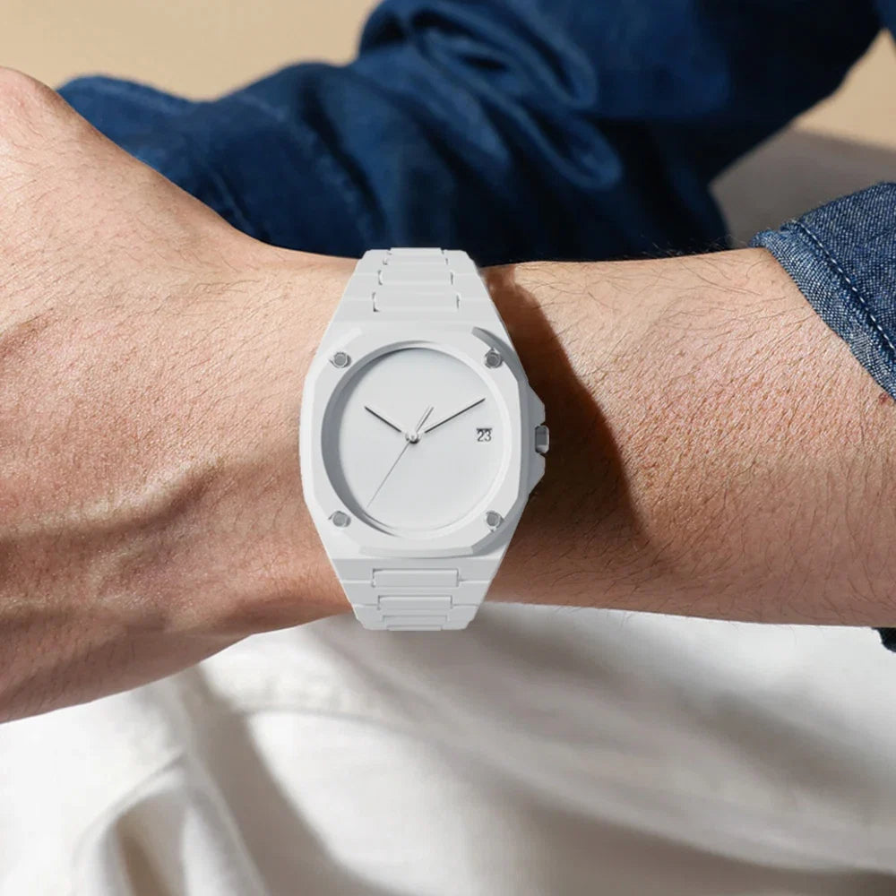 Close-up of men's precision monochrome minimalist watch. Sleek black dial, silver hands & markers, a modern elegant timepiece.