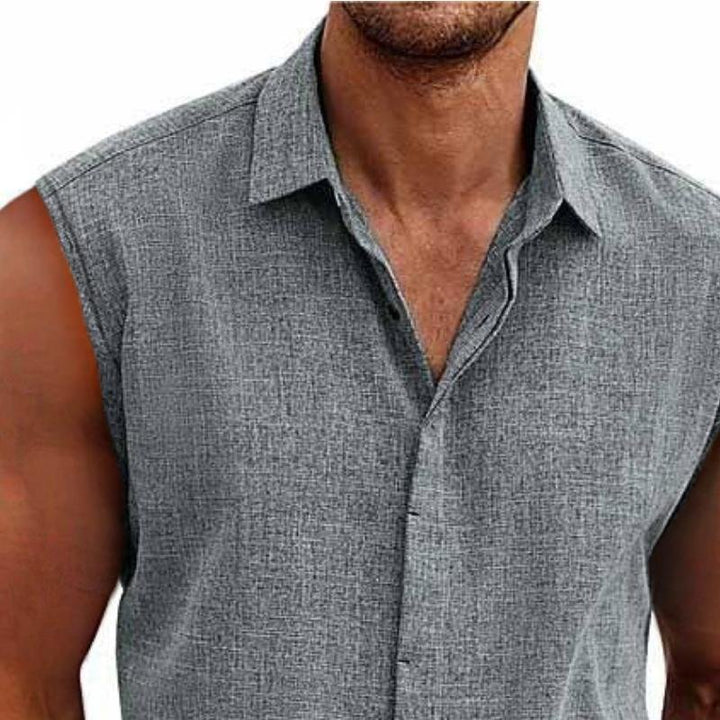 Collared men's sleeveless button-down shirt. Smart casual tank top with a relaxed fit for summer comfort & vacation.