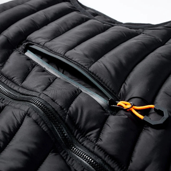Robust men's cold weather puffer vest, water resistant and sleeveless for winter adventures.