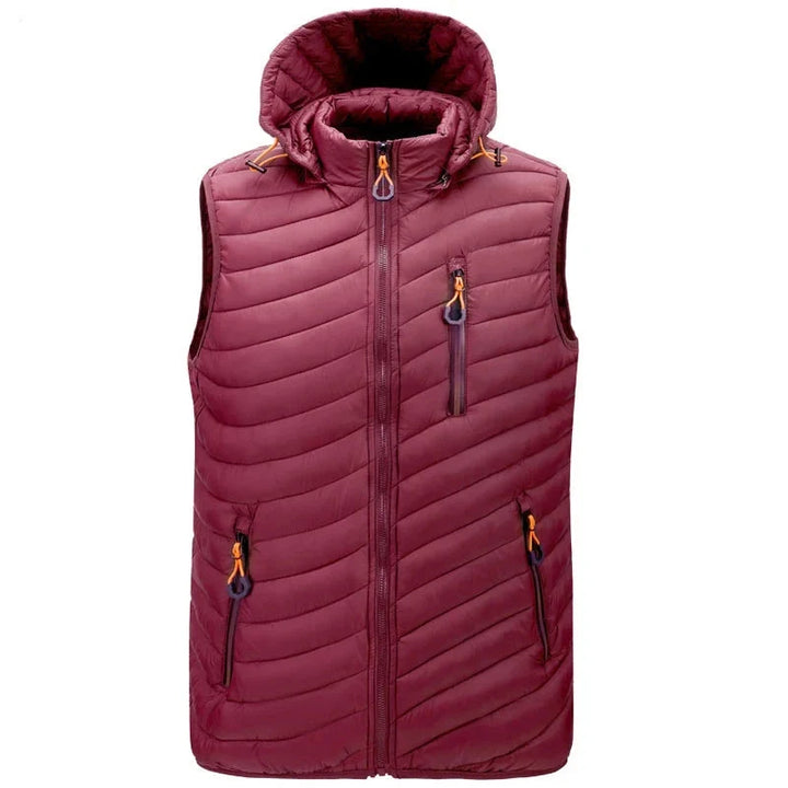 Men's cold weather puffer vest featuring practical zip pockets & sleeveless comfort for winter.