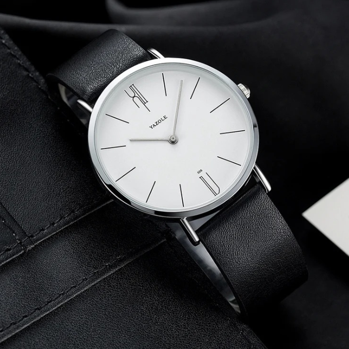 Modern minimalist men's watch. Slim cowhide leather band, clean dial, versatile accessory.