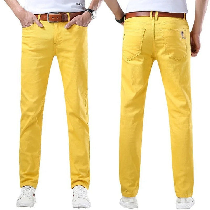 Bright yellow men's slim fit denim pants, offering versatile style and comfort for men.