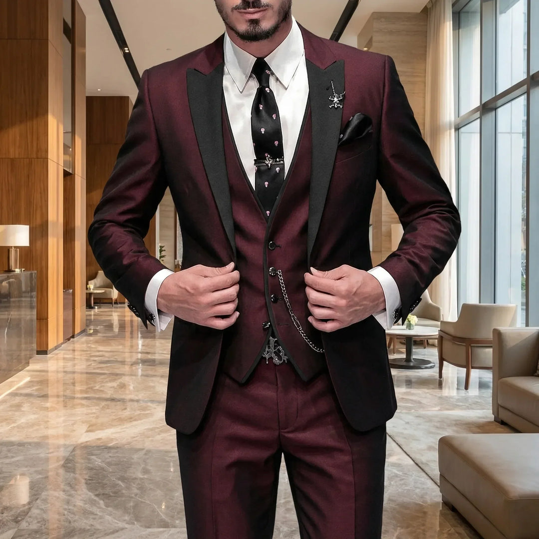 Men's slim-fit burgundy 3-piece formal suit for weddings & business. Tailored with contrast lapel.