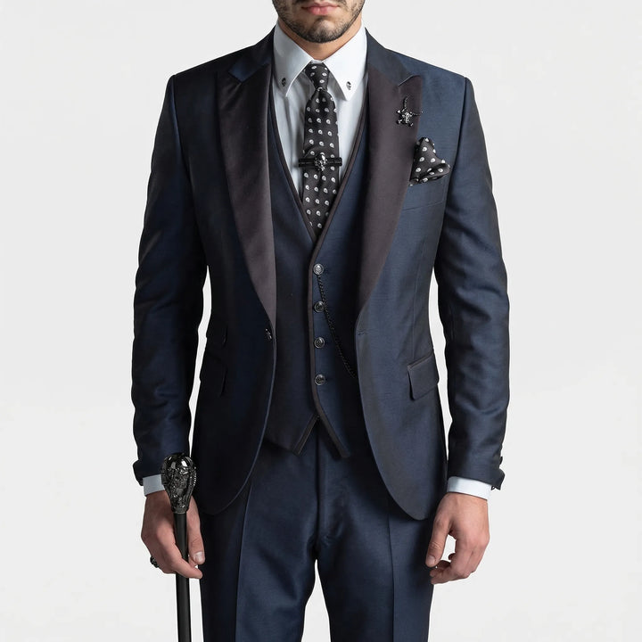 Man wearing a sharp burgundy slim-fit 3-piece suit, perfect for a wedding or business event.