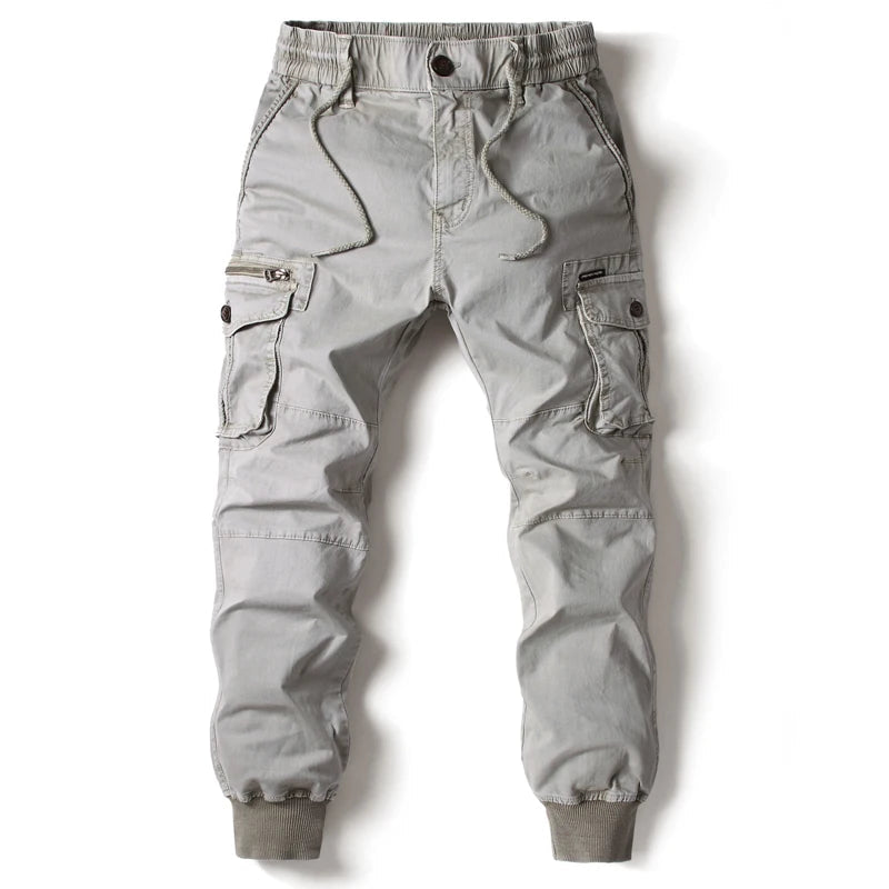 Men's slim fit cargo joggers in black with multiple utility pockets, perfect for street style & casual wear.