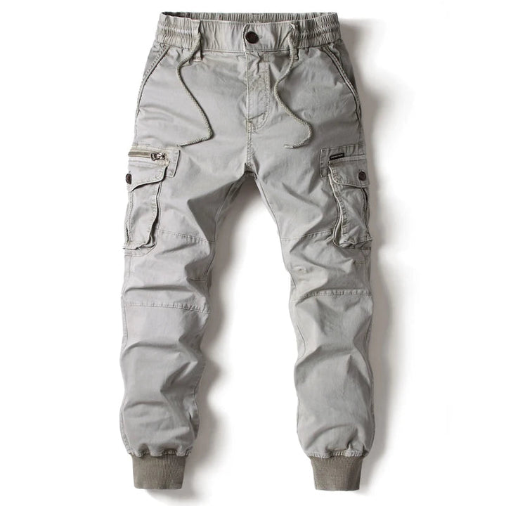 Men's slim fit cargo joggers in black with multiple utility pockets, perfect for street style & casual wear.