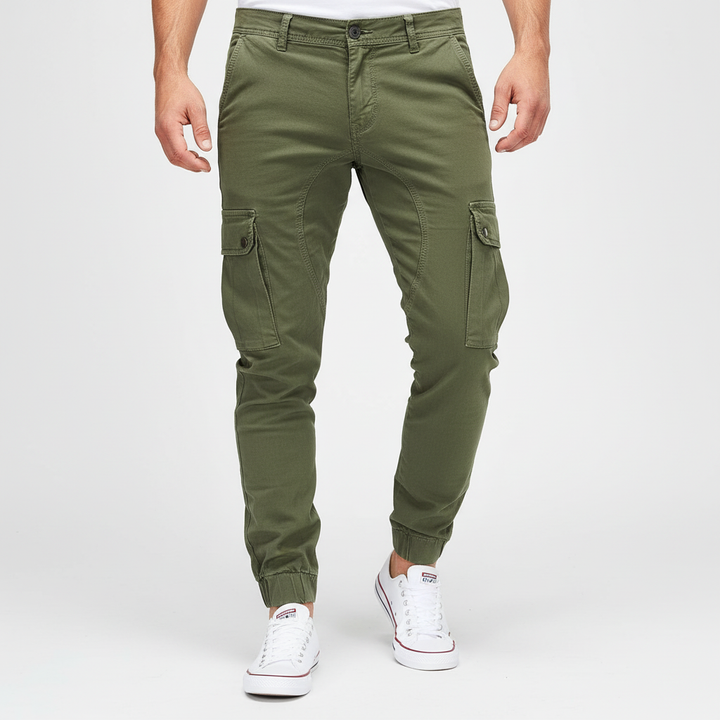 Full shot of men's slim fit cargo pants in an urban setting, showcasing modern casual style.
