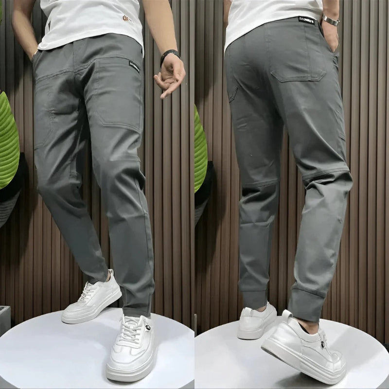 Versatile men's slim fit cargo trousers with practical pockets, ideal for a modern, confident look.