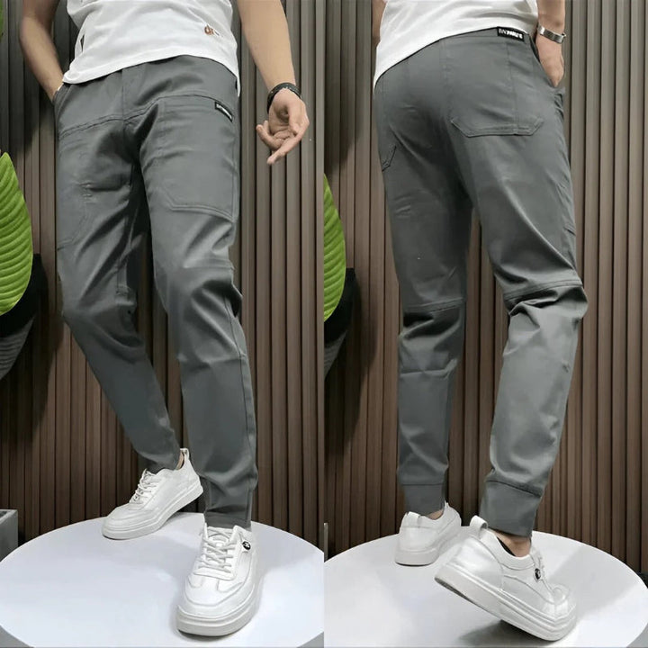 Versatile men's slim fit cargo trousers with practical pockets, ideal for a modern, confident look.