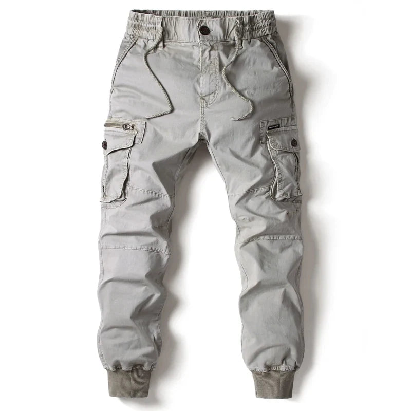 Comfortable men's slim fit cargo pants featuring multiple utility pockets, great for active casual wear.