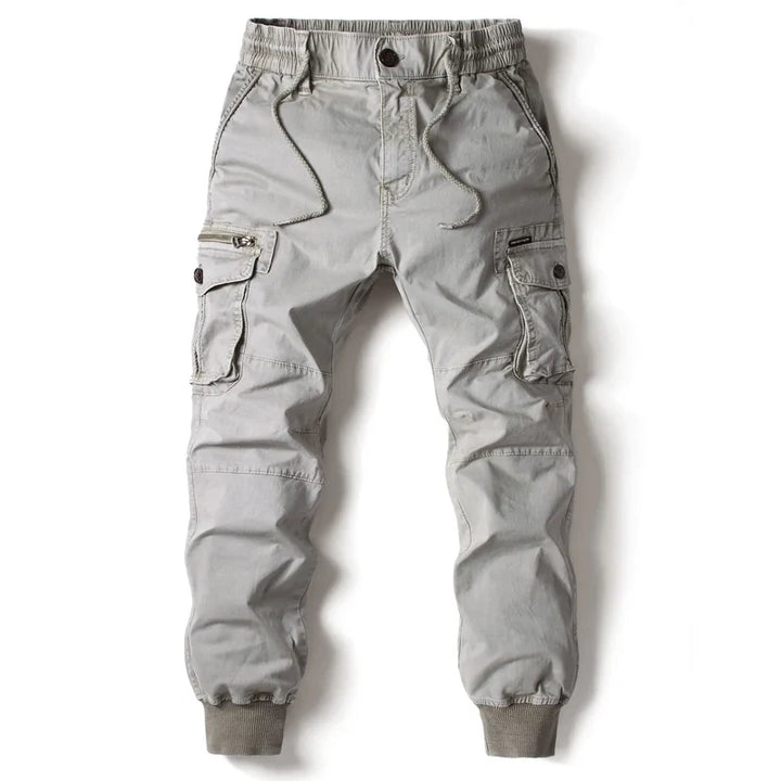 Comfortable men's slim fit cargo pants featuring multiple utility pockets, great for active casual wear.