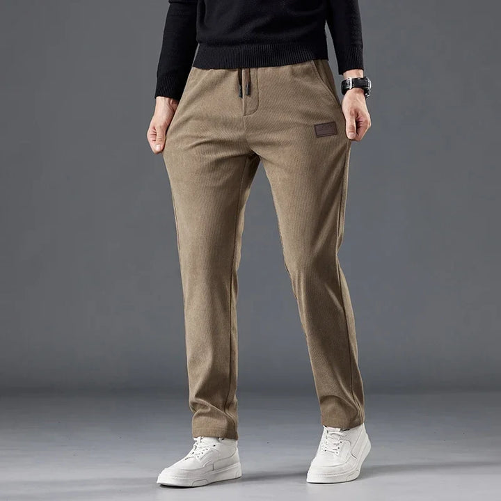 Khaki men's slim fit casual drawstring pants, comfortable & wrinkle-resistant for versatile style.