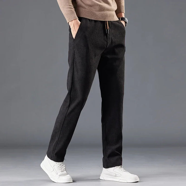 Blue men's slim fit casual pants, modern style for comfortable & versatile everyday wear.