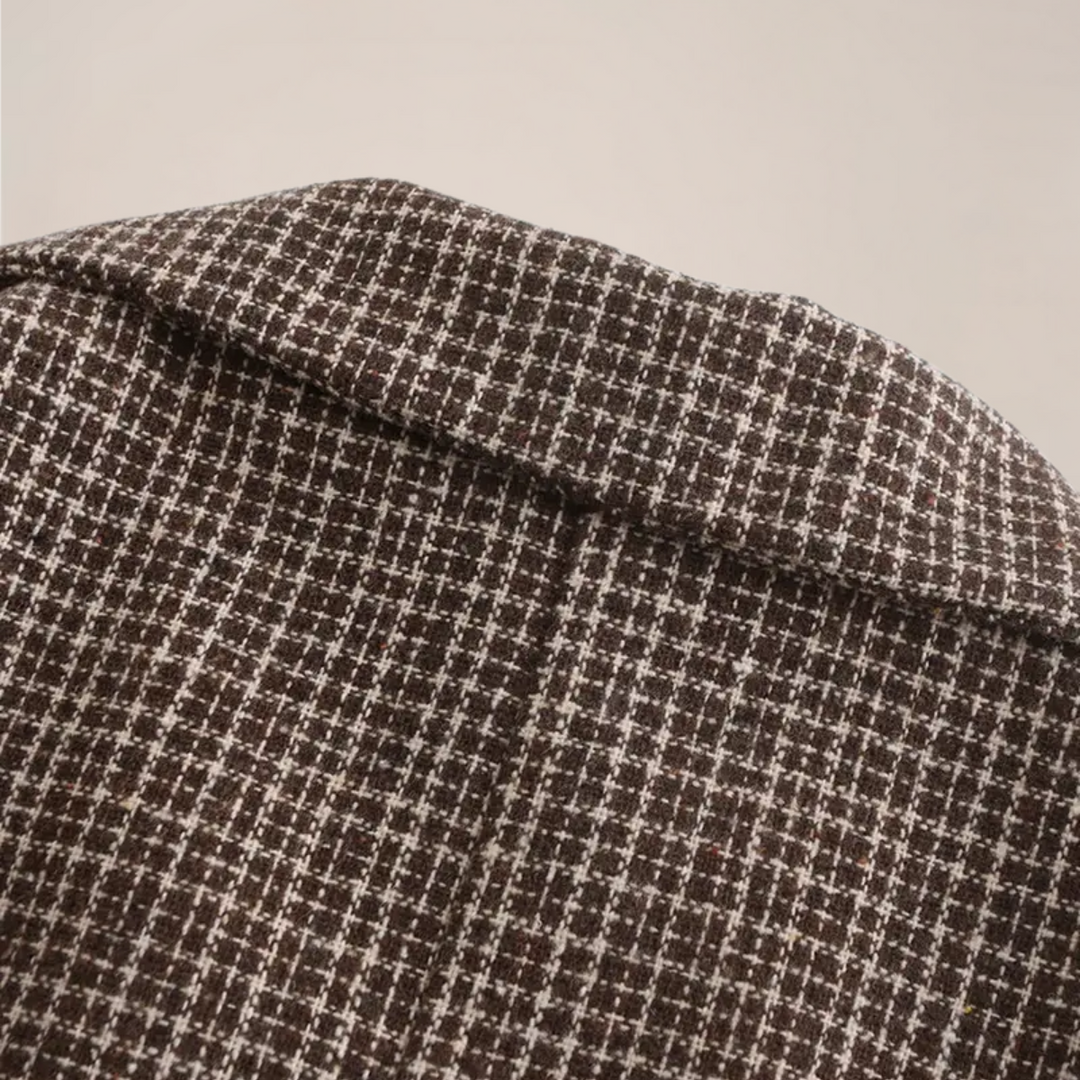 Elegant men's slim fit check pattern blazer. A tailored jacket for business or formal wear.
