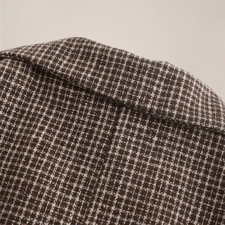Elegant men's slim fit check pattern blazer. A tailored jacket for business or formal wear.