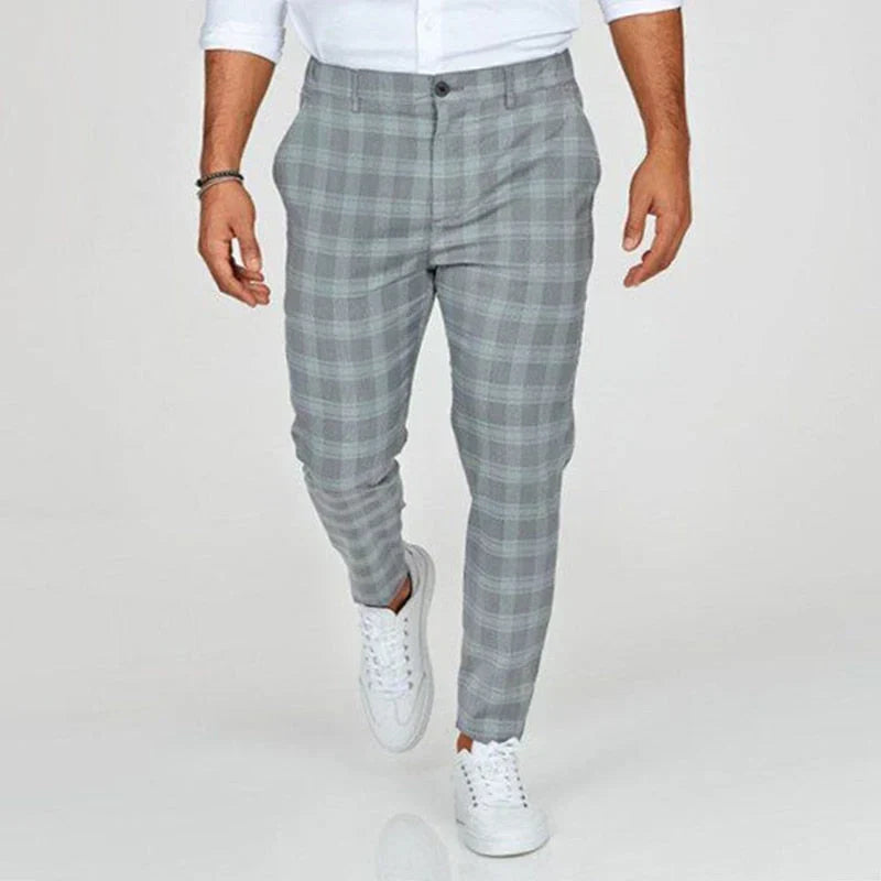 Stylish men's slim fit cropped pants with a sophisticated checked pattern.